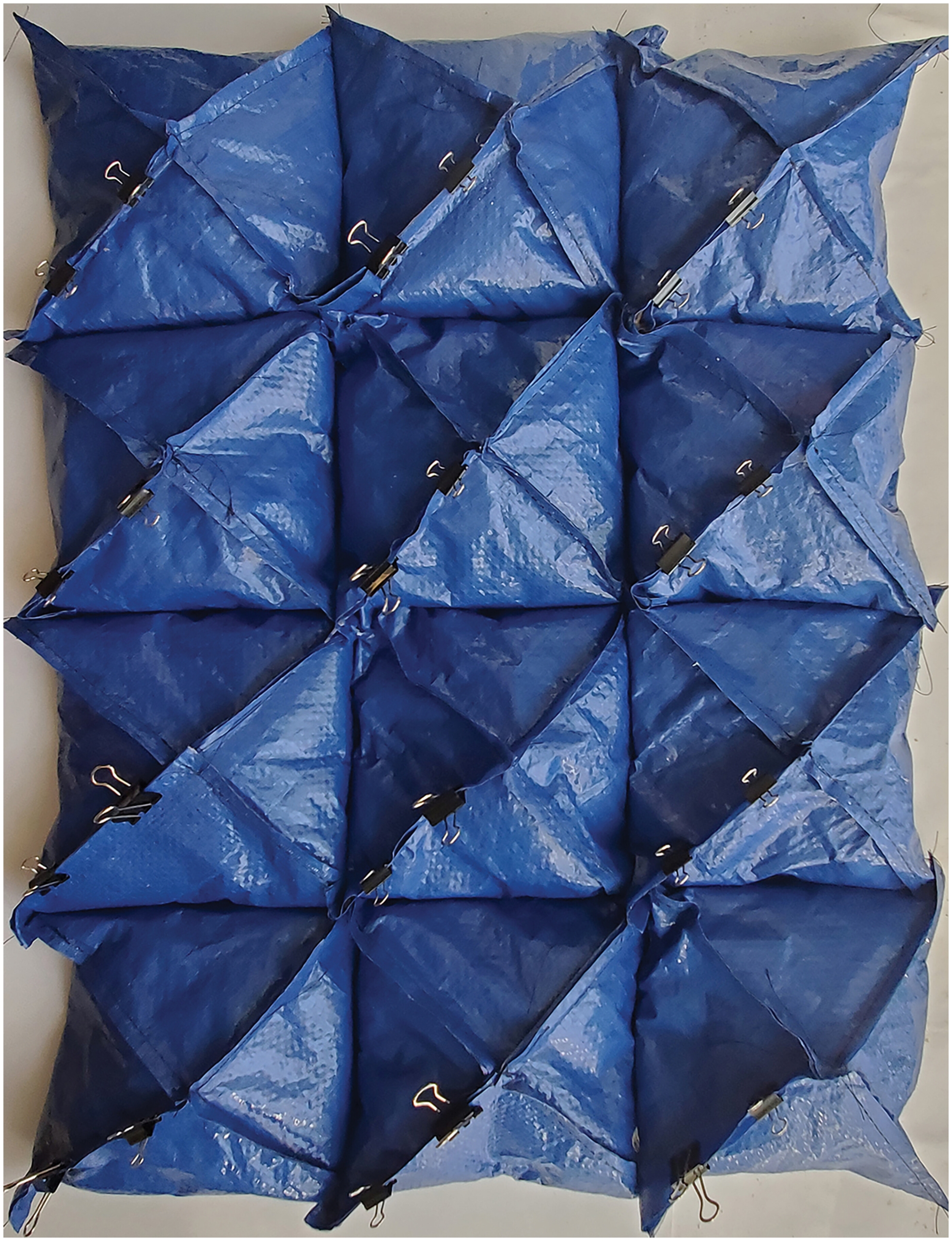 Re-Fashioning Earthbag Construction: Engaging Textile Waste Through Flexible-Formed Modular Rammed Earth Construction
